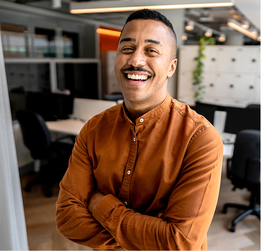 Man in orange shirt laughing